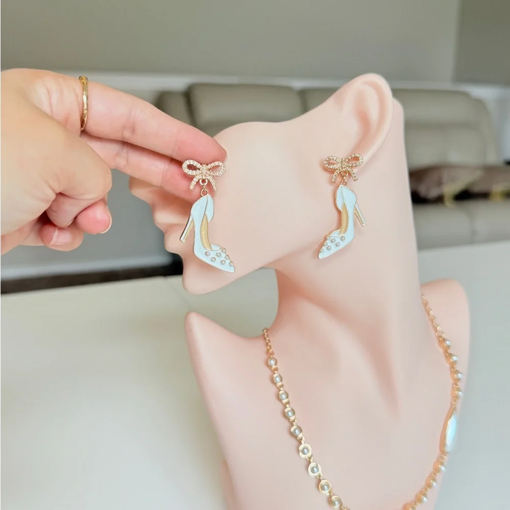 White Enamel High Heel Drop Earrings with Gold Bow
